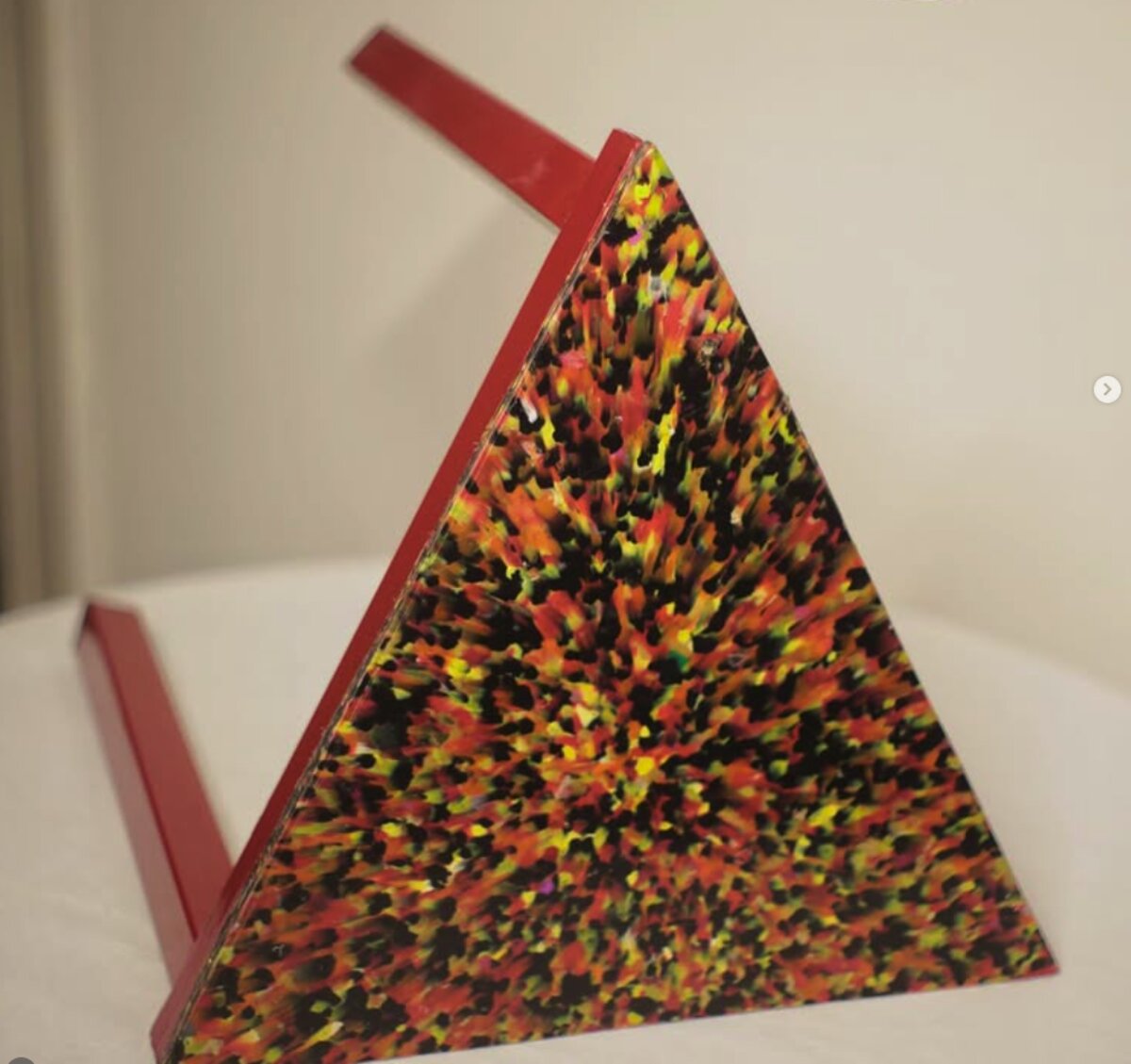 Recycled-plastic triangular panel, speckled sheet detail